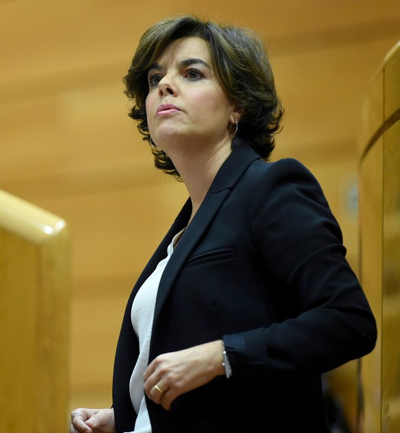 epa06291167 Spanish Deputy Prime Minister Soraya Saenz de Santamaria gives a speech during the Upper Chamber of the Spanish Parliament or Senado session in Madrid, Spain, 26 October 2017, to apply the ...