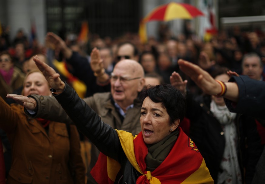 Supporters rise their right arm to salute the fascist anthem to remember former Spanish dictator Francisco Franco on the 43rd anniversary of his death, in Madrid, Spain, Sunday, Nov. 18, 2018. Hundred ...