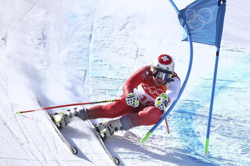 Switzerland&#039;s Beat Feuz makes a turn during the men&#039;s super-G at the 2018 Winter Olympics in Jeongseon, South Korea, Friday, Feb. 16, 2018. (AP Photo/Alessandro Trovati)