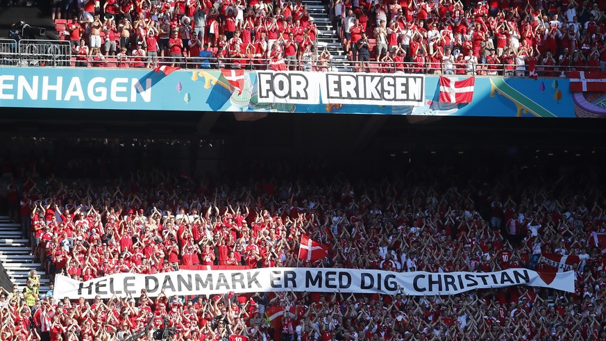 epa09280147 Supporters of Denmark show a banner in support of player Christian Eriksen of Denmark before the UEFA EURO 2020 group B preliminary round soccer match between Denmark and Belgium in Copenh ...