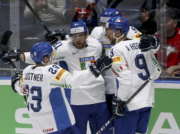 Italy&#039;s players celebrate after scoring during the Ice Hockey World Championships group B match between Austria and Italy at the Ondrej Nepela Arena in Bratislava, Slovakia, Monday, May 20, 2019. ...