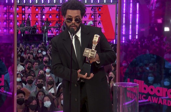 In this video image provided by NBC, The Weeknd accepts the top artist award during the Billboard Music Awards on Sunday, May 23, 2021. (NBC via AP)