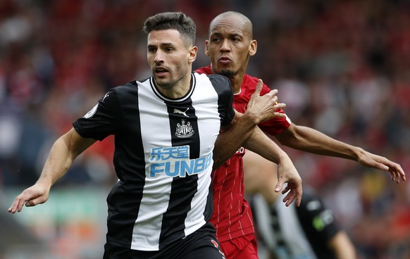 Liverpool&#039;s Fabinho, right, challenges Newcastle&#039;s Fabian Schar during the English Premier League soccer match between Liverpool and Newcastle at Anfield stadium in Liverpool, England, Satur ...