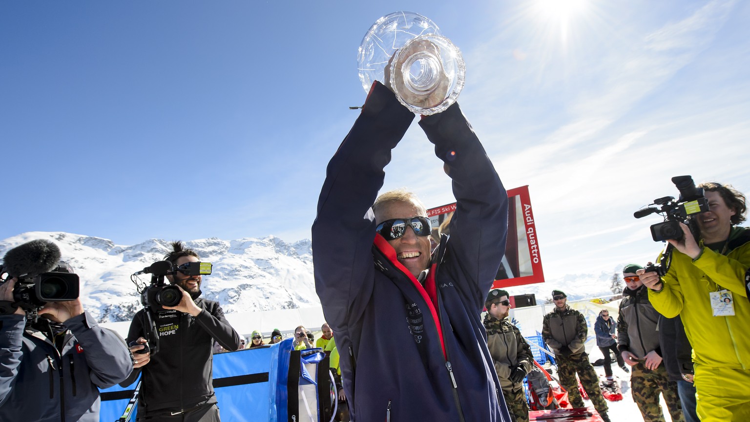 Pauli Gut the father of Lara Gut of Switerland, poses with the women&#039;s Alpine Skiing World Cup Overall trophy during the podium ceremony at the FIS Alpine Ski World Cup Finals, in St. Moritz, Swi ...