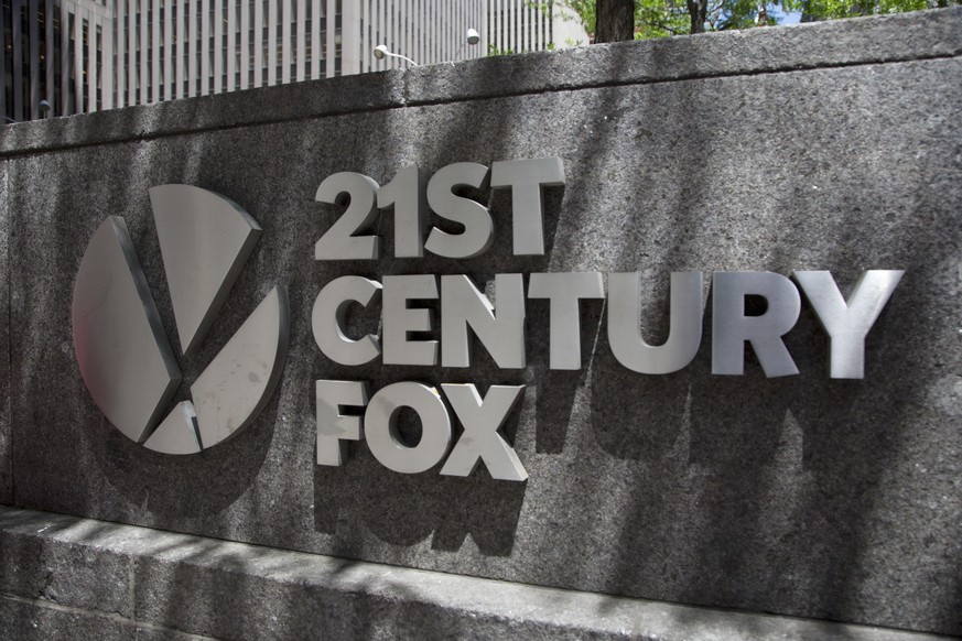 The 21st Century Fox logo is shown outside its New York office, Thursday, June 14, 2018. Competing bids from Comcast and Disney for the bulk of Twenty-First Century Fox come as the media landscape cha ...