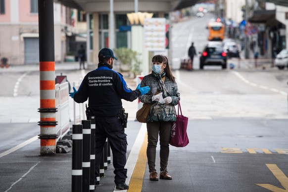 Members of the Swiss Border Guard Corps are on duty at the Swiss-Italian border in Chiasso, Switzerland, on Saturday, March 14, 2020. Because of the Coronavirus, Switzerland wants to control the borde ...
