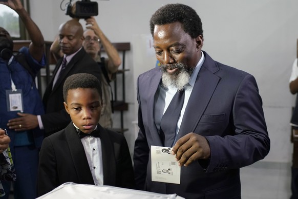 Congolese President Joseph Kabila arrives to cast his vote Sunday, Dec. 30, 2018 in Kinshasa, Congo. Forty million voters are registered for a presidential race plagued by years of delay and persisten ...