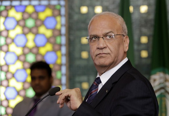 FILE - In this Aug. 11, 2014 file photo, Palestinian negotiator, Saeb Erekat, speaks during a press conference, following an emergency meeting at the Arab League headquarters in Cairo, Egypt. Palestin ...