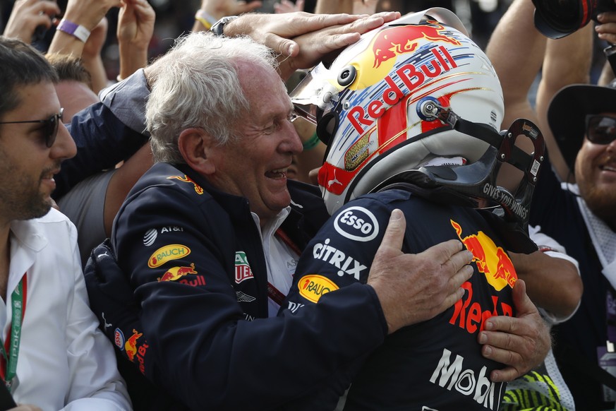 Red Bull driver Max Verstappen, of the Netherlands, right, celebrates with Helmut Marko, of his team during the Brazilian Formula One Grand Prix at the Interlagos race track in Sao Paulo, Brazil, Sund ...