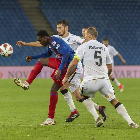 Basel&#039;s Dimitri Oberlin fights for the ball against Anorthosis&#039; Kostakis Artymatas and Gordon Schildenfeld, from left, during the UEFA Europa League third qualifying round soccer match betwe ...