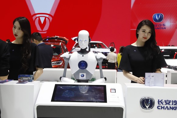 FILE - In this April 26, 2018, file photo, a robot assist receptionist is seen at the booth of a Chinese automaker during the China Auto 2018 show in Beijing, China. Under President Xi Jinping, a prog ...