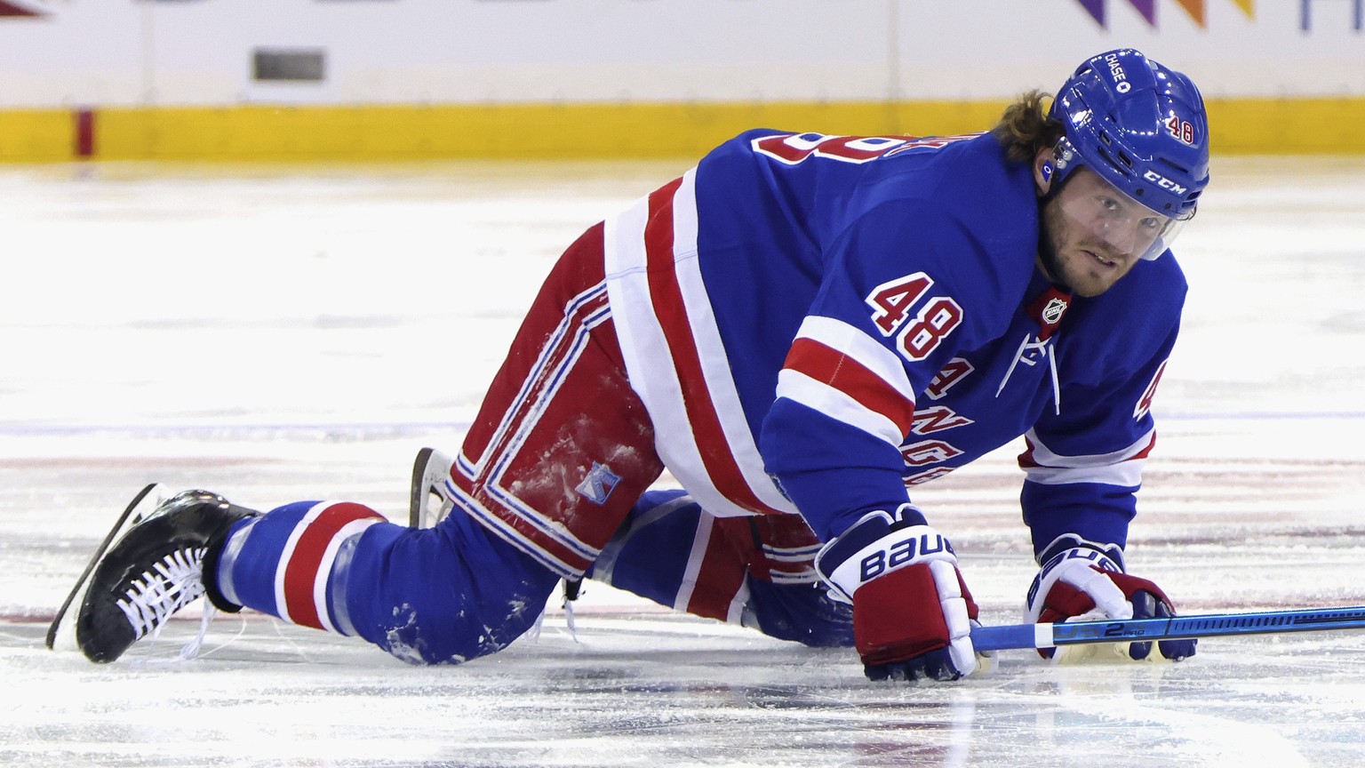 New York Rangers&#039; Brendan Lemieux crawls back to the bench after blocking a second-period shot against the New Jersey Devils in an NHL hockey game Tuesday, Jan. 19, 2021, in New York. (Bruce Benn ...