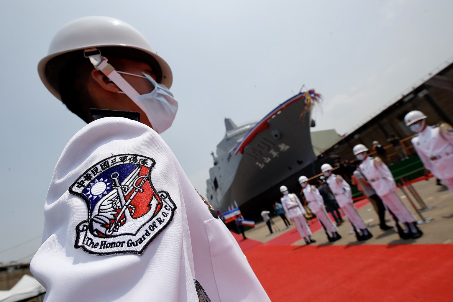 epa09131922 Members of Taiwanese honor guard stand during the official launching of Taiwan?s new amphibious transport dock YU SHAN (LPD-1401) in Kaohsiung, Taiwan, 13 April 2021. The navy?s new 10,600 ...