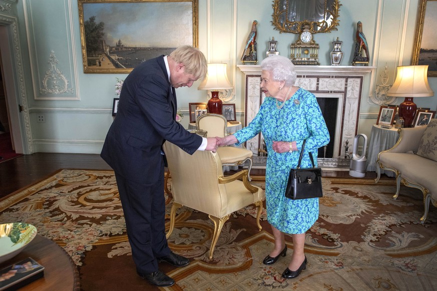 epa07848229 (FILE) - Britain&#039;s Queen Elizabeth II welcomes Boris Johnson during an audience where she invited him to become Prime Minister and form a new government, in Buckingham Palace, London, ...