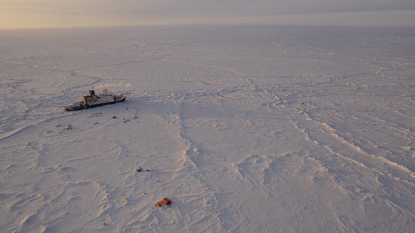 In this Friday, April 24, 2020 photo provide by the Alfred Wegener Insitute shows the German Arctic research vessel Polarstern in the ice next to a research camp in the Arctic region. Dozens of scient ...