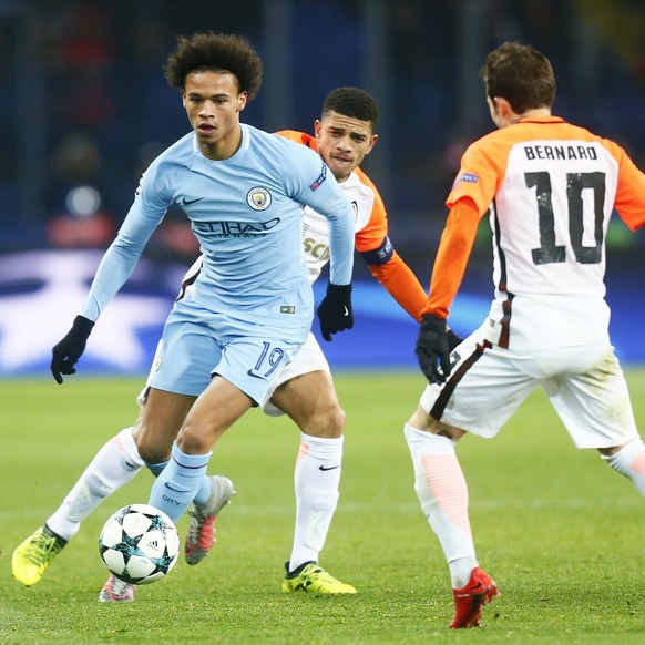 Manchester City&#039;s Leroy Sane, left, is challenged by Shakhtar&#039;s Bernard during the Champions League group F soccer match between Manchester City and Shakhtar Donetsk at the Metalist Stadium  ...