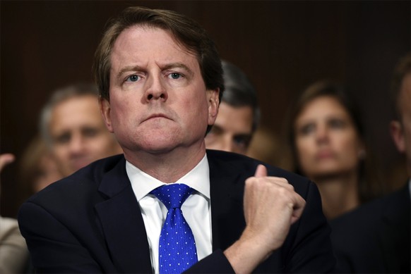 FILE - In this Sept. 27, 2018, file photo, then-White House counsel Don McGahn listens as Supreme court nominee Brett Kavanaugh testifies before the Senate Judiciary Committee on Capitol Hill in Washi ...