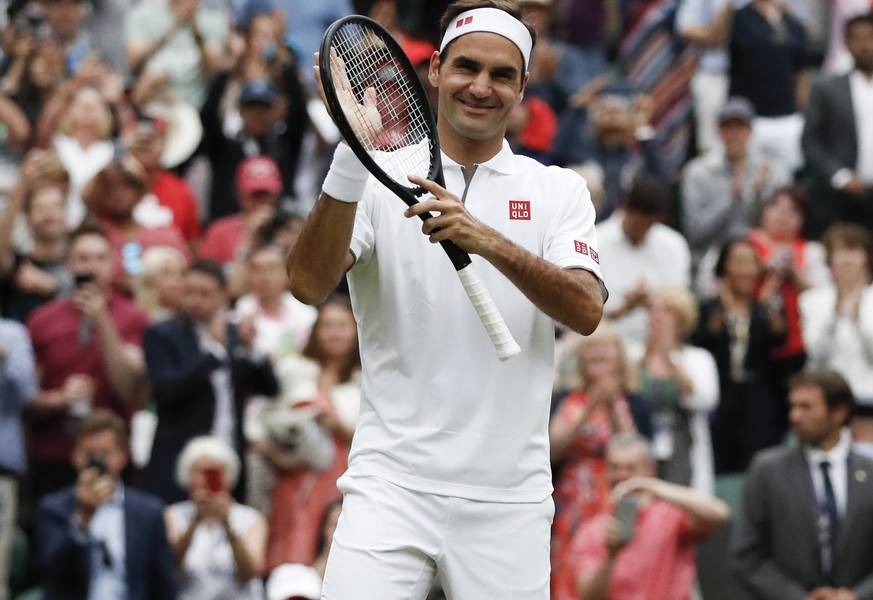 Switzerland&#039;s Roger Federer celebrates defeating Italy&#039;s Matteo Berrettini in a men&#039;s singles match during day seven of the Wimbledon Tennis Championships in London, Monday, July 8, 201 ...