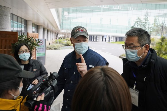 Peter Daszak of the World Health Organization team speaks to journalists before entering the VIP terminal of the airport to leave at the end of the WHO mission in Wuhan in central China&#039;s Hubei p ...