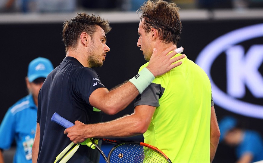 epa06449783 Tennys Sandgren (R) of the USA is congratulated by Stan Wawrinka (L) of Switzerland after winning their second round match at the Australian Open Grand Slam tennis tournament in Melbourne, ...