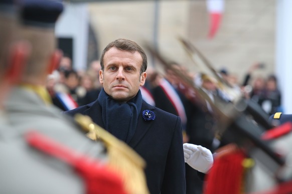 epa07995471 French President Emmanuel Macron reviews the troops during a visit at the World War I (WWI) Battle of the Marne Memorial in Dormans, France, 14 November 2019. EPA/FRANCOIS NASCIMBENI / POO ...