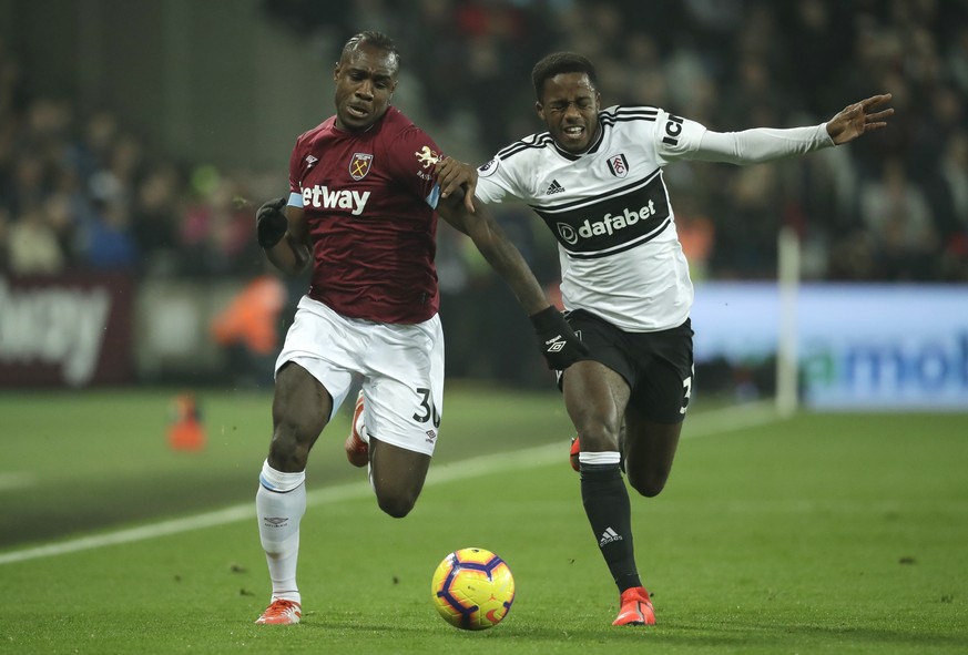 West Ham&#039;s Michail Antonio, left, vie for the ball with Fulham&#039;s Ryan Sessegnon during the English Premier League soccer match between West Ham and Fulham at the London Stadium in London, Fr ...