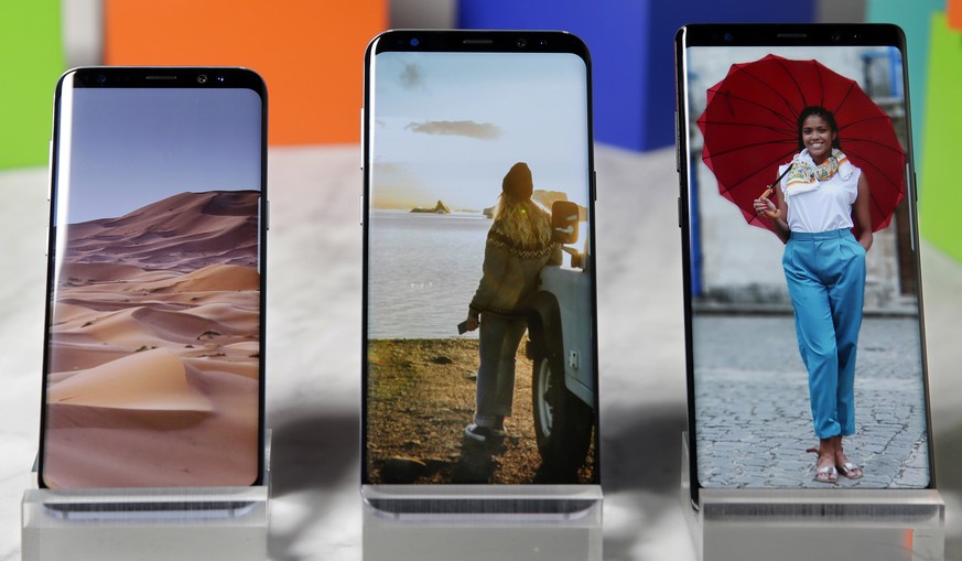 This Aug. 16, 2017, photo, shows a Samsung Galaxy S8, left, a Samsung Galaxy S8 Plus, center, and Samsung Galaxy Note 8 on display, in New York. (AP Photo/Richard Drew)