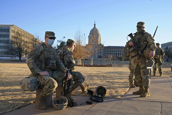 Oklahoma National Guard is stationed on the mostly empty grounds around the state Capitol Sunday, Jan. 17, 2021, in Oklahoma City. (AP Photo/Sue Ogrocki)