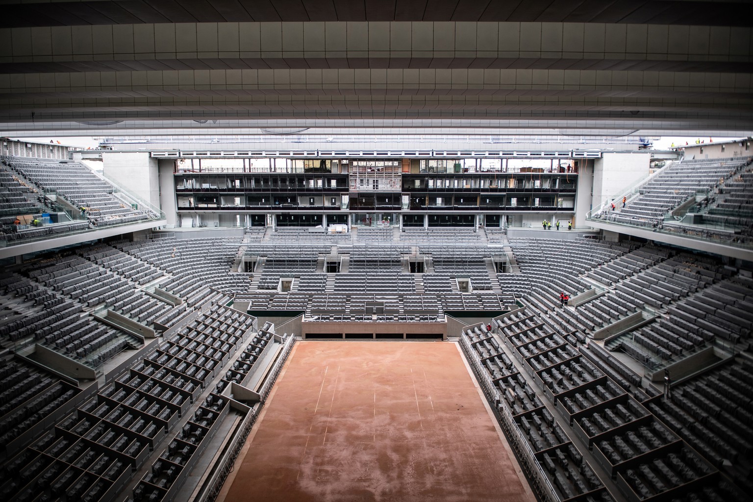 The construction work of the newly built roof of the Philippe Chatrier center court is pictured Wednesday Feb.5, 2020 at the Roland Garros stadium. The French Open venue becomes the last of the four G ...