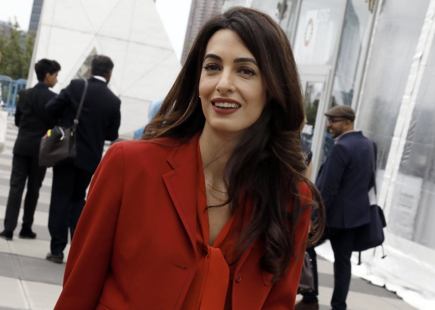 epa06479141 (FILE) - Amal Clooney, International law and human rights lawyer, exits the United Nations after attending a Security Council meeting during the 3rd day of the General Debate of the 72nd U ...