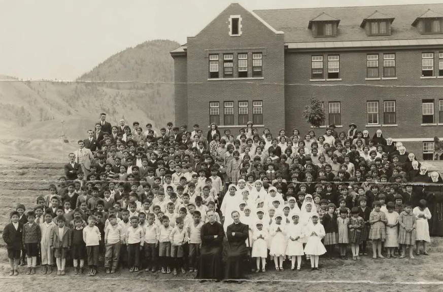 epa09236277 A handout photo made available by the National Centre for Truth and Reconciliation at the University of Manitoba reportedly shows a gathering at the Kamloops Indian Residential School in K ...