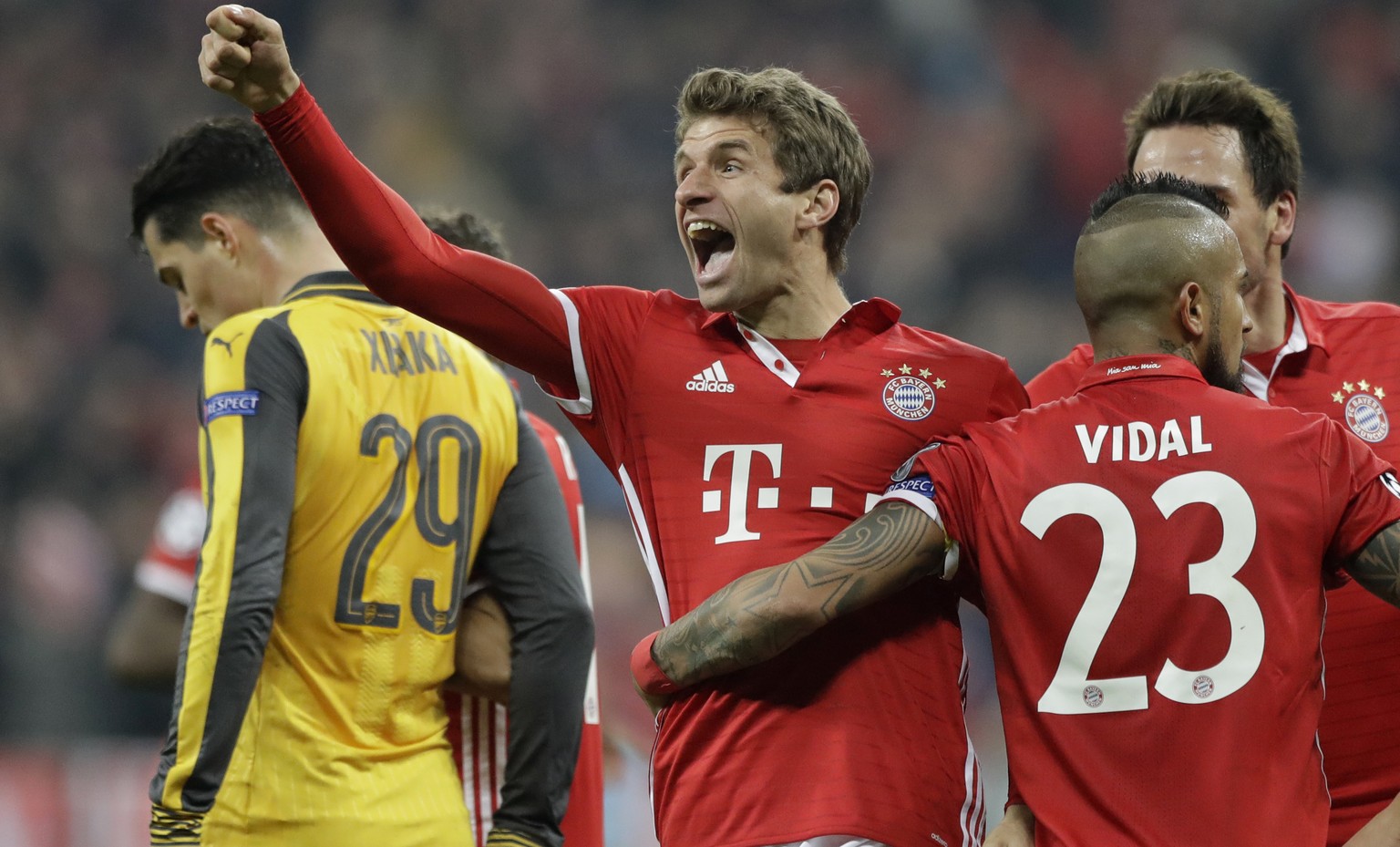 Bayern&#039;s Thomas Mueller, center, celebrates after scoring his side&#039;s fifth goal during the Champions League round of 16 first leg soccer match between FC Bayern Munich and Arsenal, in Munich ...