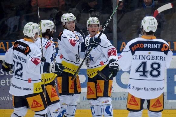 Zug&#039;s player Santeri Alatalo, center, celebrates the 0-1 goal, during the preliminary round game of National League A (NLA) Swiss Championship 2016/17 between HC Ambri Piotta and EV Zug, at the i ...