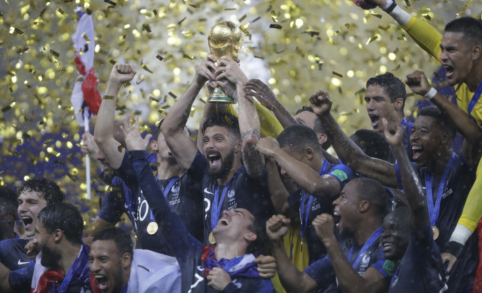French players celebrates with the trophy after the final match against Croatia at the 2018 soccer World Cup in the Luzhniki Stadium in Moscow, Russia, Sunday, July 15, 2018. (AP Photo/Natacha Pisaren ...