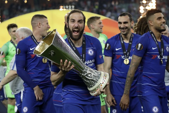 Chelsea&#039;s Gonzalo Higuain celebrates with the trophy after winning the Europa League Final soccer match between Arsenal and Chelsea at the Olympic stadium in Baku, Azerbaijan, Wednesday, May 29,  ...