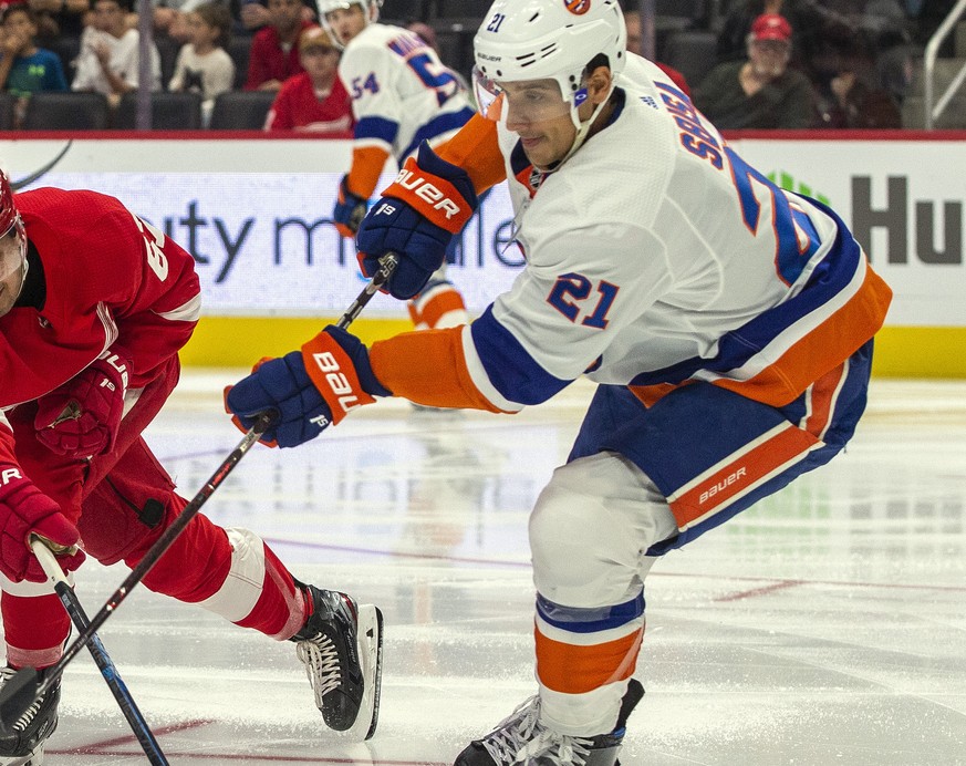 Detroit Red Wings forward Taro Hirose (67) challenges a pass from New York Islanders defenseman Luca Sbisa (21), of Italy, in the second period of a preseason NHL hockey game Friday, Sept. 20, 2019, i ...