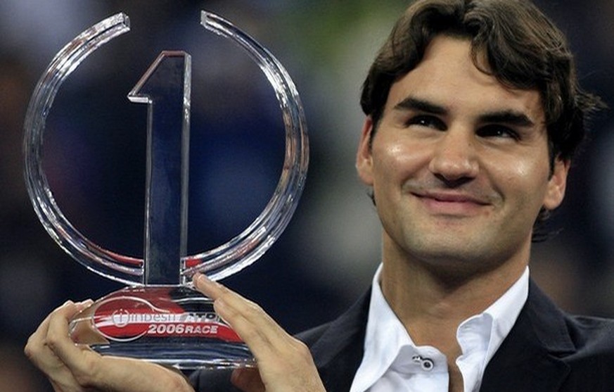World number one Roger Federer of Switzerland holds the Indesit ATP 2006 trophy at an award presentation, 13 November 2006, at the Tennis Masters Cup in Shanghai. Federer won the trophy for the third  ...