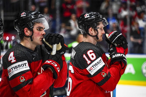 epa07604321 Canadian players Dante Fabbro (L) and Jared McCann (R) show their dejection after the IIHF World Championship ice hockey final between Canada and Finland at the Ondrej Nepela Arena in Brat ...