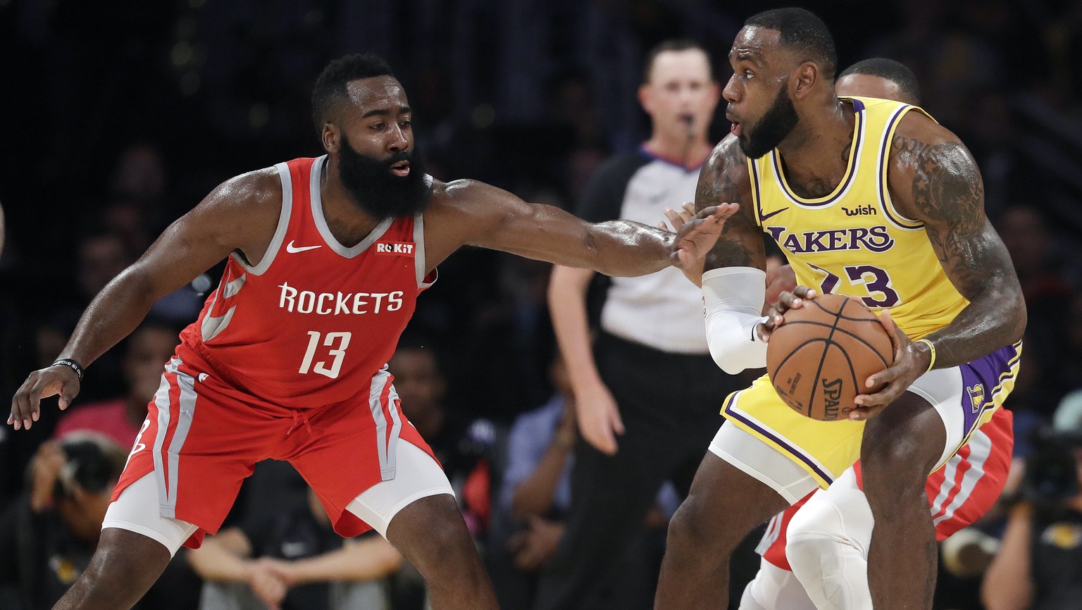 Houston Rockets&#039; James Harden (13) defends on Los Angeles Lakers&#039; LeBron James during the first half of an NBA basketball game Saturday, Oct. 20, 2018, in Los Angeles. (AP Photo/Marcio Jose  ...