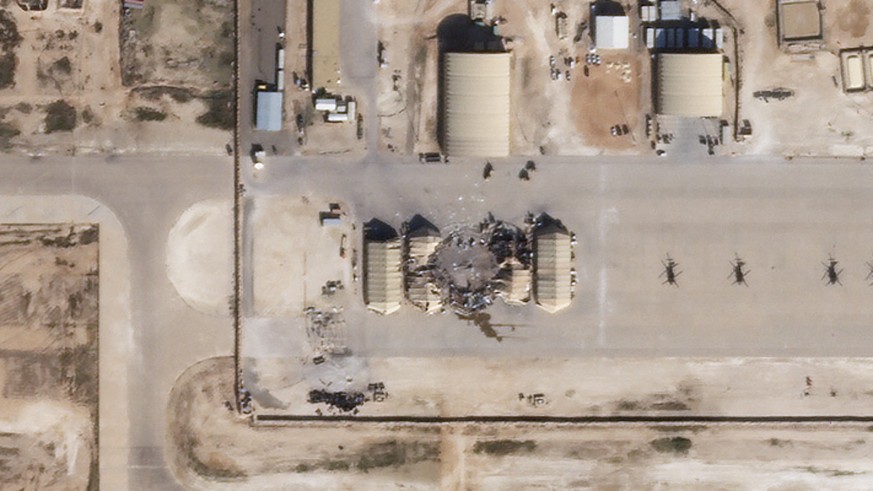 epa08114442 A handout photo made available by Planet Labs Inc. of a satellite image showing damaged and destroyed buildings at Al Asad Air Base in Iraq, 08 January 2020 (issued 09 January 2020). Iran  ...