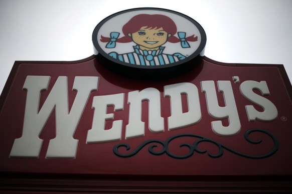 FILE - This Monday, March 17, 2014, file photo shows a sign outside a Wendy&#039;s restaurant in Pittsburgh. The Wendy&#039;s Co. reports earnings, Wednesday, May 10, 2017. (AP Photo/Gene J. Puskar, F ...