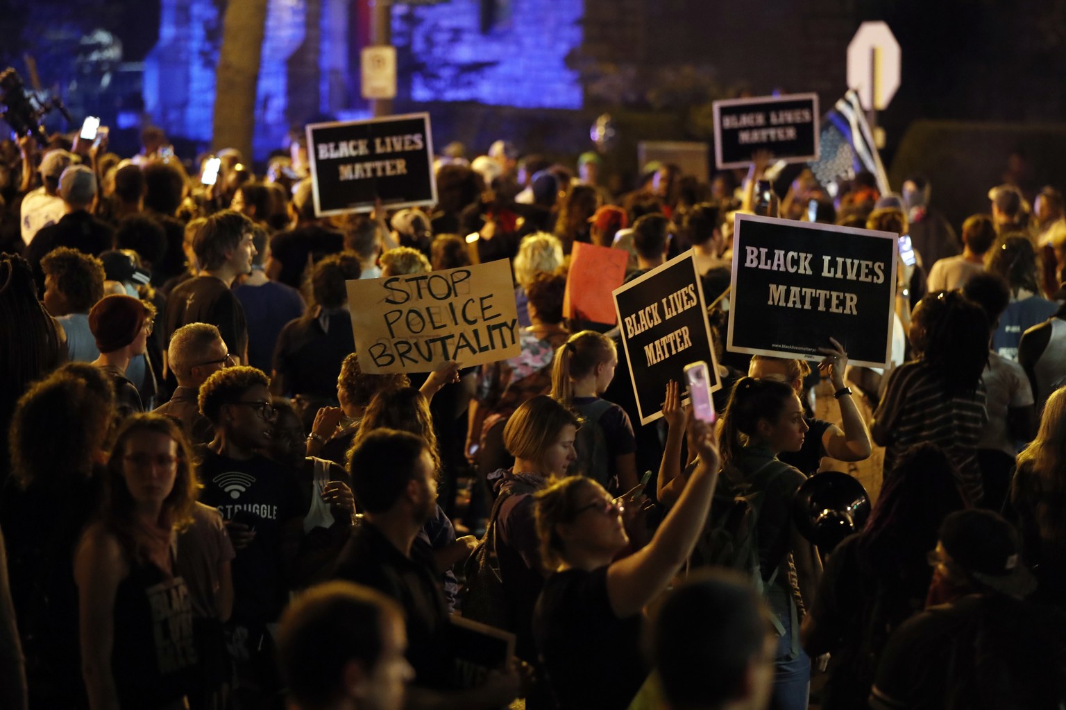 Protesters gather, Friday, Sept. 15, 2017, in St. Louis, after a judge found a white former St. Louis police officer, Jason Stockley, not guilty of first-degree murder in the death of a black man, Ant ...