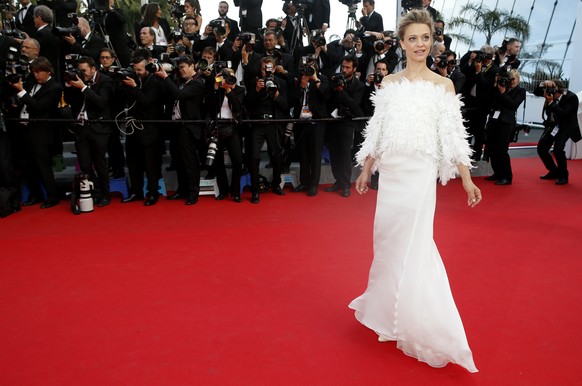 German actress Heike Makatsch poses as she arrives for the screening of How to Train Your Dragon 2 at the 67th international film festival, Cannes, southern France, Friday, May 16, 2014. (AP Photo/Ala ...