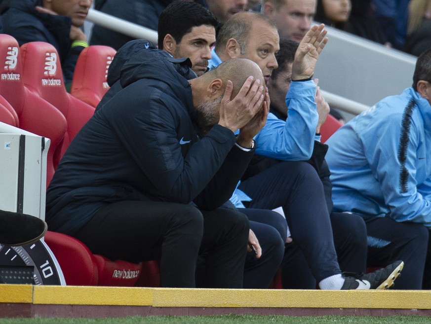 epa07077155 Manchester City manager Pep Guardiola reacts during the English Premier League soccer match between Liverpool and Manchester City at Anfield, Liverpool, Britain, 07 October 2018. EPA/PETER ...