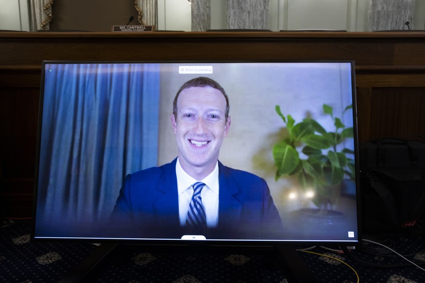 Facebook CEO Mark Zuckerberg appears on a screen as he speaks remotely during a hearing before the Senate Commerce Committee on Capitol Hill, Wednesday, Oct. 28, 2020, in Washington. The committee sum ...