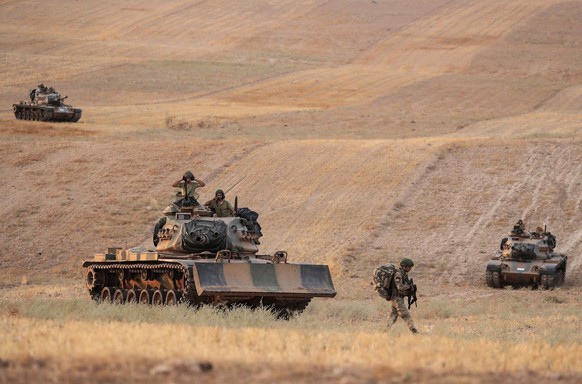 In this Monday, Oct.14, 2019 photo made available Tuesday, Oct. 15, 2019, Turkey&#039;s forces advance towards Manbij, Syria. U.S. military spokesman says U.S. forces have left Kurdish-held town of Ma ...