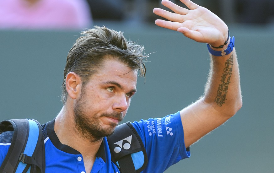 Switzerland&#039;s tennis player Stanislas &quot;Stan&quot; Wawrinka, reacts after losing a game against to Marton Fucsovics of Hungary, in their quarter final match during the Geneva Open tournament  ...