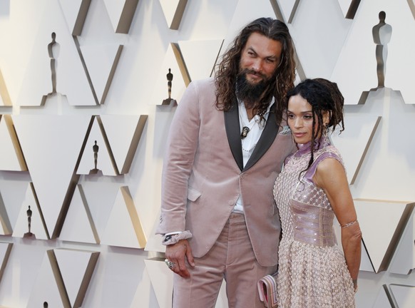 epa07394699 Jason Momoa (L) and Lisa Bonet (R) arrive for the 91st annual Academy Awards ceremony at the Dolby Theatre in Hollywood, California, USA, 24 February 2019. The Oscars are presented for out ...