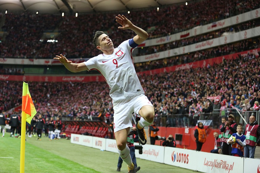 In this photo taken on Sunday, Oct. 8, 2017, Poland&#039;s Robert Lewandowski celebrates after he scored a goal during the World Cup Group E qualifying soccer match between Poland and Montenegro at Na ...