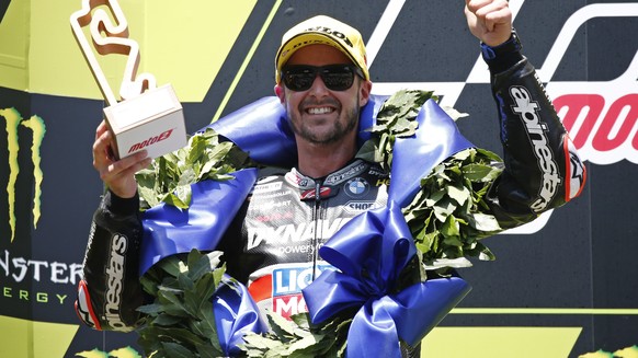 Swiss Tom Luethi celebrates after his second place at the Moto2 Catalunya Motorcycle Grand Prix at the Barcelona Catalunya racetrack in Montmelo, near Barcelona, Spain, on Sunday June 16, 2019. (AP Ph ...